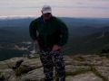 Dad rests at the summit (stow entrance below).jpg